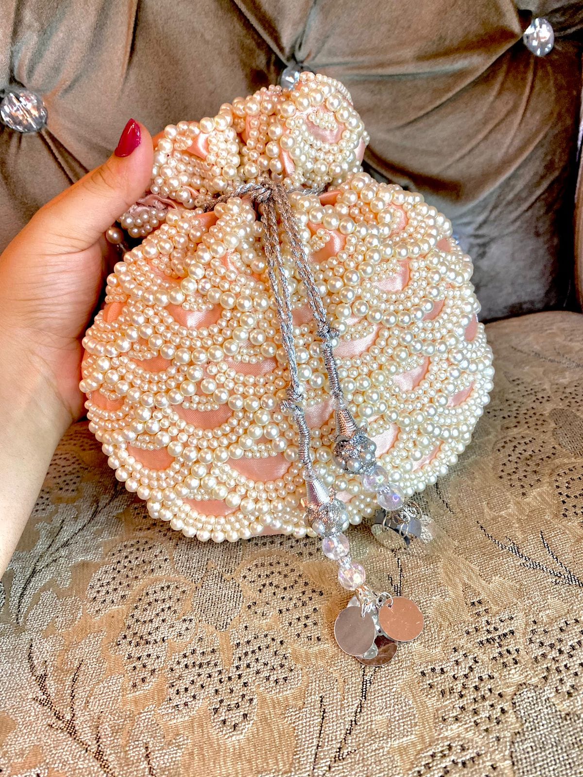 db55d060-a8fe-486c-b8d0-a73f76f9239a Potli Bag in Peach with Pearls - Image 1