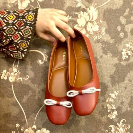 Maroon pumps with bow detailing
