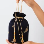 Black Potli With Golden Bunch For Her