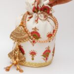 The Ivory Blossom Potli Bag with Golden Beaded Tassels For Her