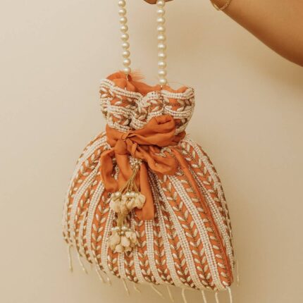 Light Pink Potli With White Pearls For Her