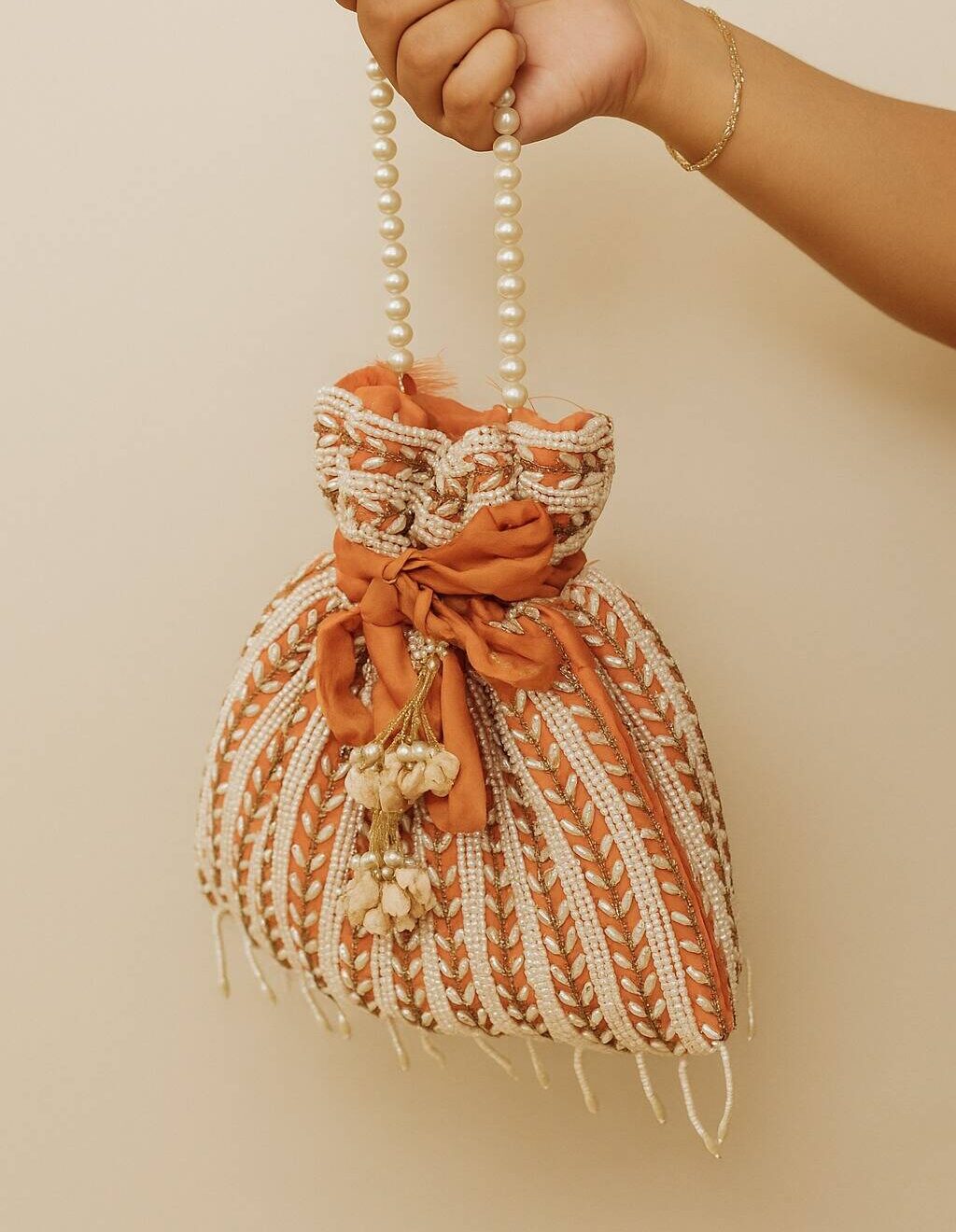 Light Pink Potli With White Pearls For Her Light Pink Potli With White Pearls For Her